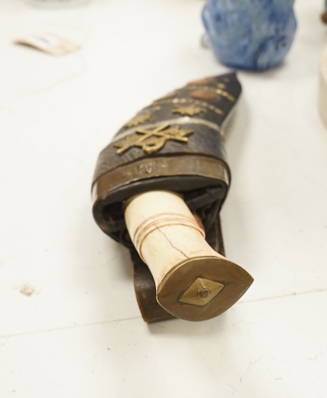 A bone handled Kukri knife, in mounted sheath